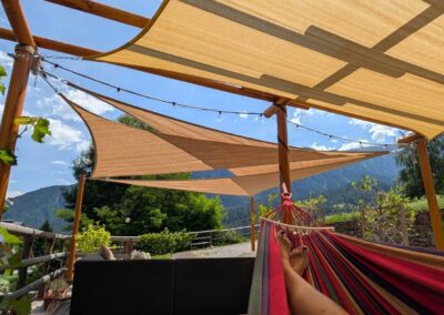 Relaxing in a hammock on the shaded terrace at Villa Meledrio with mountain views