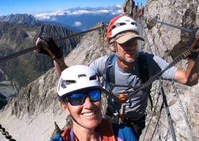 Via ferrata climbing adventure in the Italian Alps with spectacular mountain views from the Adamello, Presanella and Ortler mountains